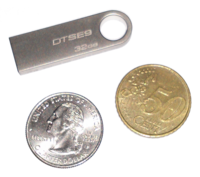 Kingston SE9 32GB with coins for size comparison